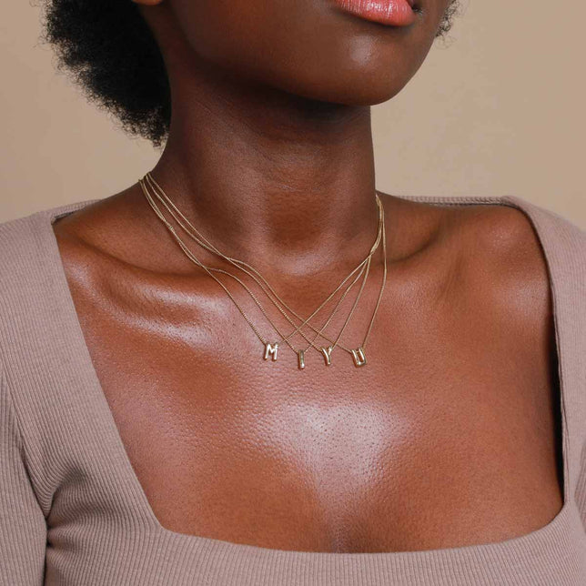 Worn shot of Y Initial Pendant Necklace in Gold